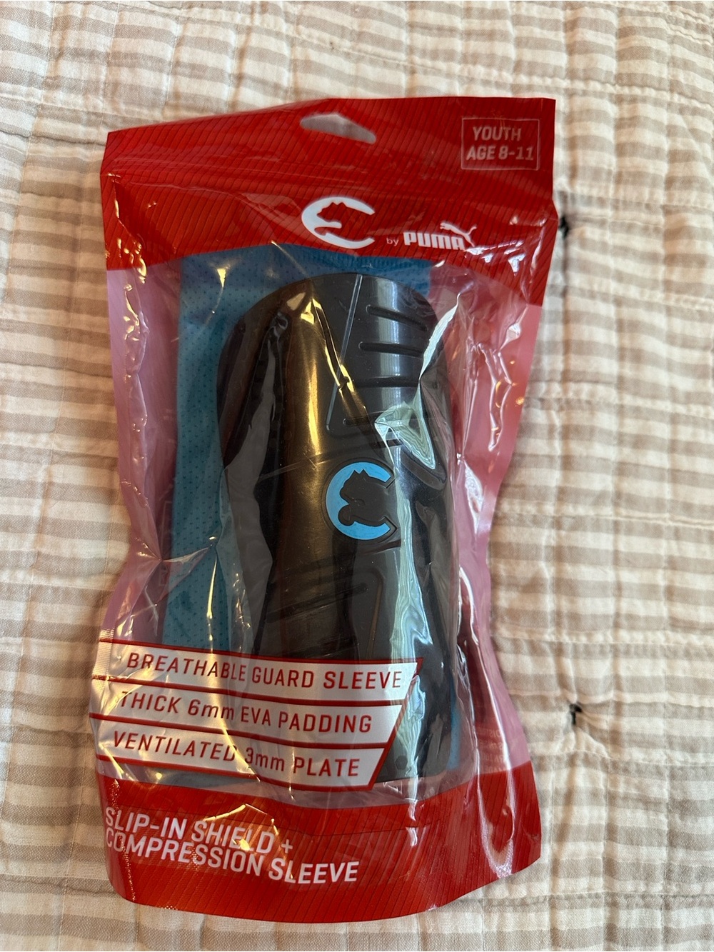 Puma Youth Black Shin Guard with Blue Logo and Teal Sleeve